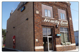 The Security Bank Minnesota branch on Main Street in Emmons, with the name painted on the brick
